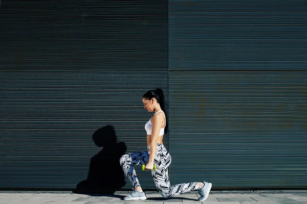 Woman working out with dumbbells