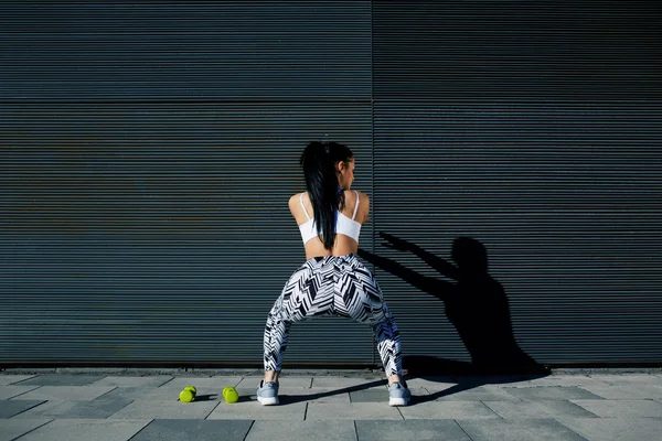 Sporty woman  doing squats
