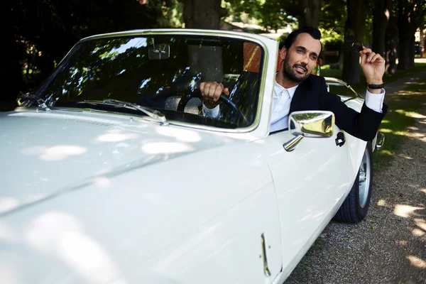 Businessman in his luxury car