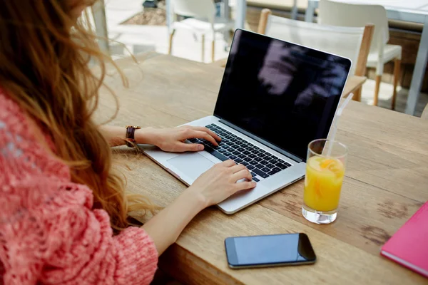 Female freelancer working outdoors