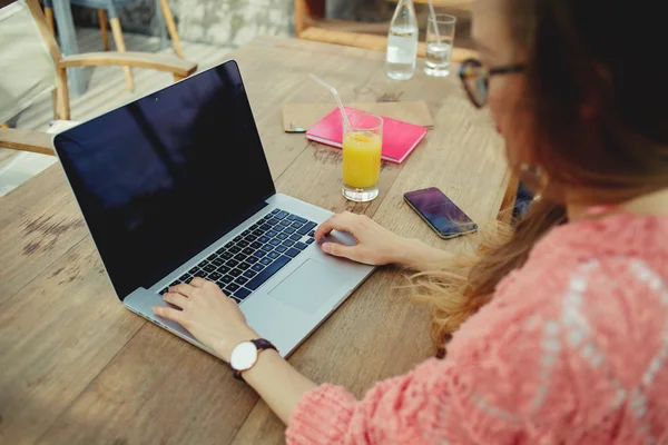 Female freelancer working outdoors