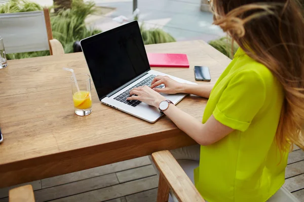 Female freelancer sitting front laptop