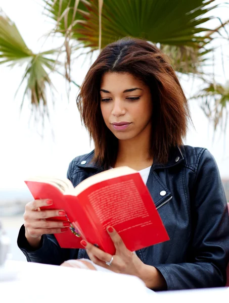 Afro american woman enjoying a interesting book