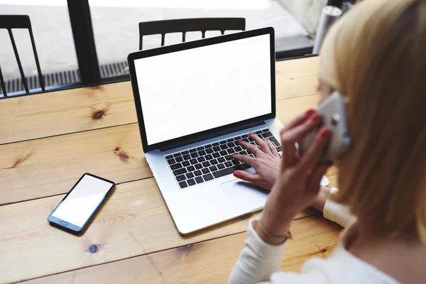 Female sitting front open laptop computer