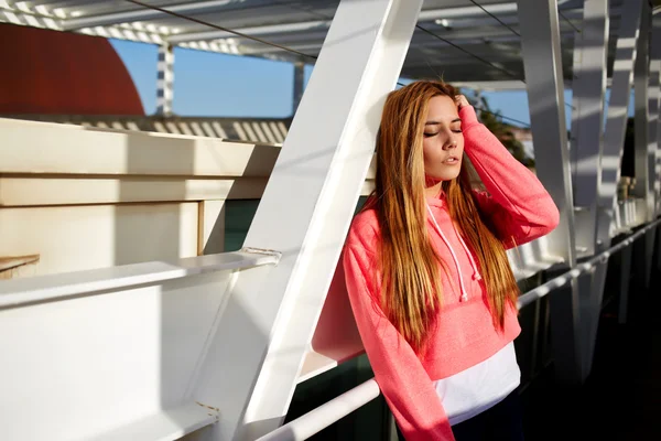 Tired woman relaxing in urban setting