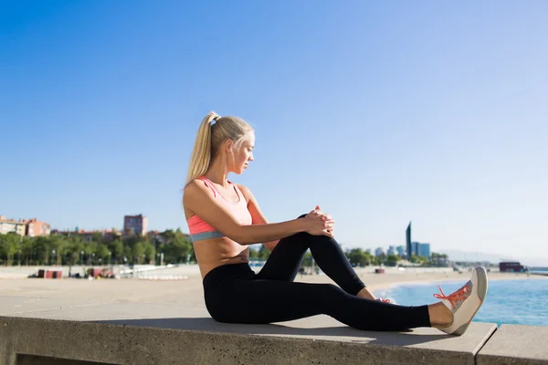 Woman enjoys resting after workout outdoors