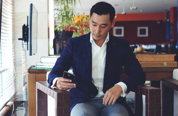 Asian businessman using mobile phone