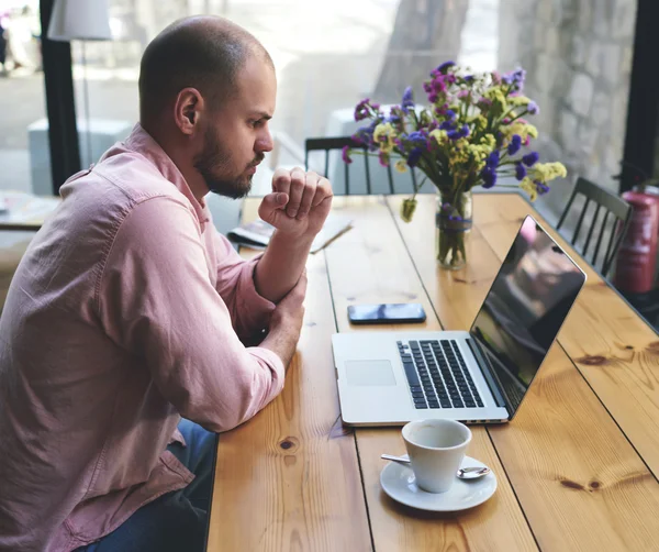 Young businessman working on laptop computer