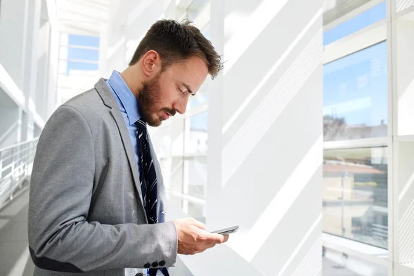 Young businessman using mobile phone