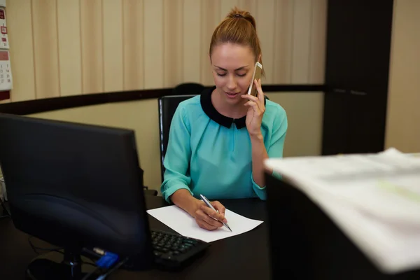 Elegant businesswoman taking on mobile phone