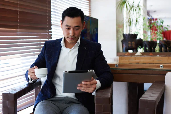 Asian businessman using touch pad