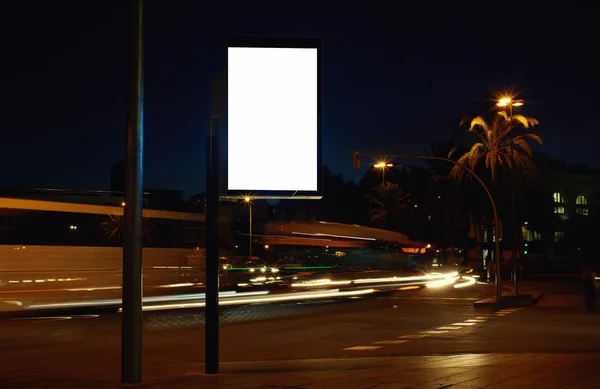 Blank billboard with night city on background