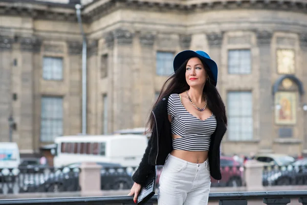 Young trendy woman posing in the street