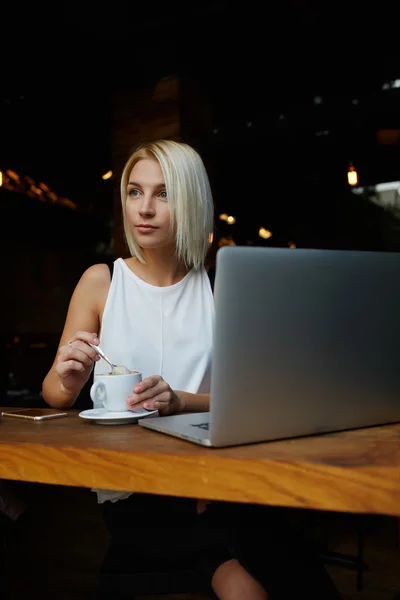 Attractive woman enjoying cup of coffee