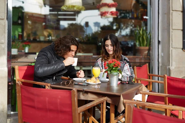 Young caucasian couple enjoying breakfast