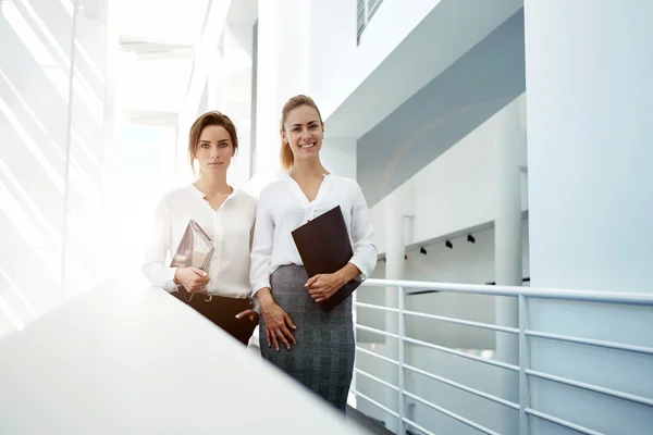 Women with touch pad and folder documents