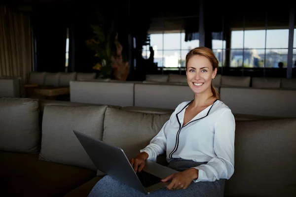 Beautiful female working on net-book