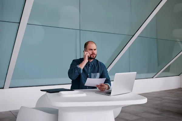 Businessman having conversation on cell telephone