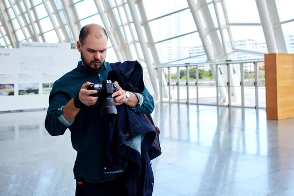 Man photographer looking at the pictures