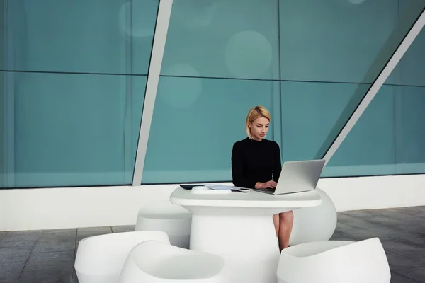 Woman keyboarding on portable net-book