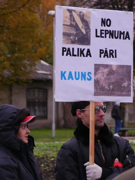 RIGA, LATVIA OCTOBER 16,2014 Civil people are voting against Nazi in Ukraine beside academy of science in October 16, 2014 Riga, Latvia