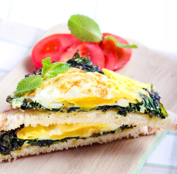 Toasts with roasted spinach and egg