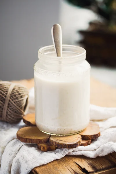 Homemade vegan milk from hemp seeds in a glass jar