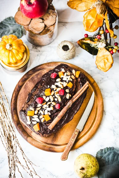 Chocolate brownie with pumpkin and frosting, vegan cakes, autumn