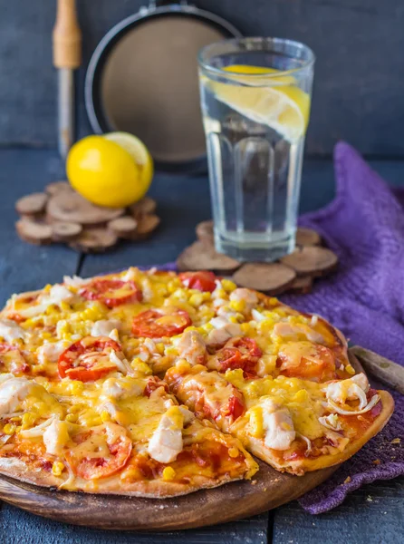 Juicy slices of pizza with chicken, corn, tomatoes and double ch