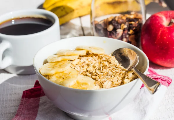 Oatmeal with bananas, apples, nuts and dried fruit jar