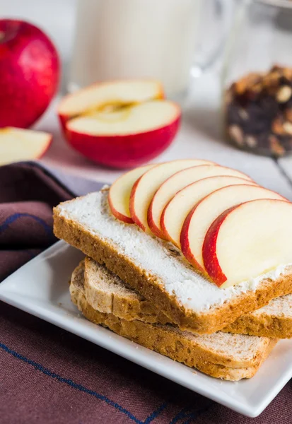 Sandwich with cheese curd, honey and red apple, snack