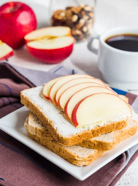 Toast with cheese curd, honey and apple, a cup of coffee
