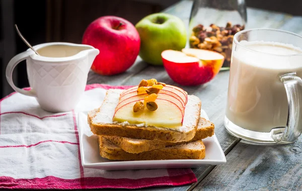 Bran toast with cheese, apple and dried fruits, healthy breakfas