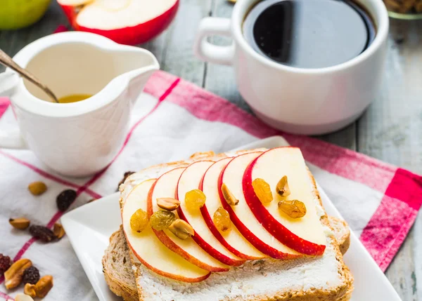 Toast with cheese, apple and dried fruit, coffee, breakfast