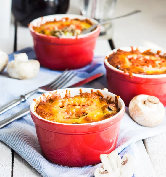 Baked mushroom julienne potatoes and tomato with cheese, lunch