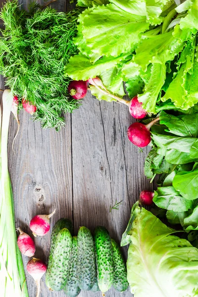 Fresh green vegetables on a wooden board, vegan, clean eating