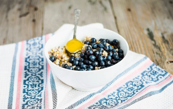 Oatmeal with poppy seeds, blueberries and honey, breakfast,selec