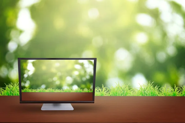 The computer on table and background nature