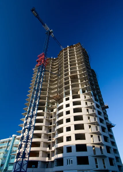 The photo of multistory building, shot on the wide lens with PL filter, in the sunset light