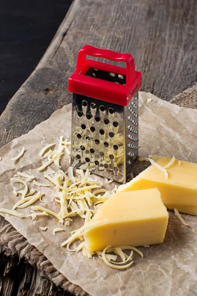 Grated cheese and metal grater
