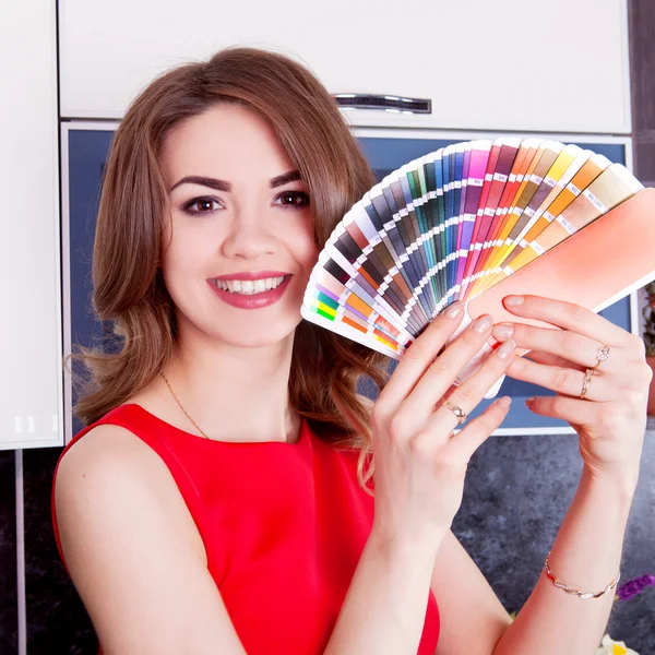 Happy girl with color palette in hand