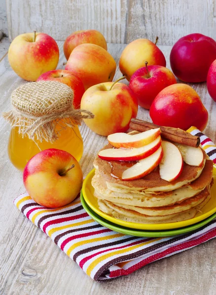 Fresh homemade pancake with apples, honey and cinnamon