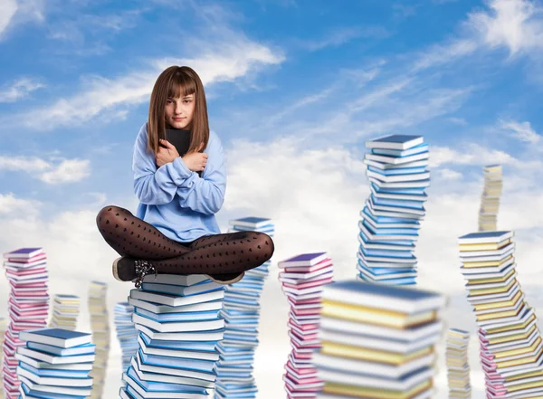 Young woman hugging book