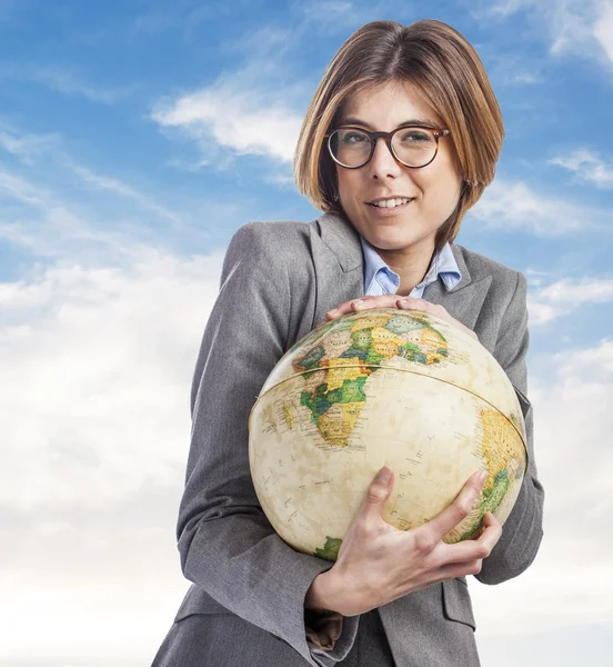 Business young woman holding globe