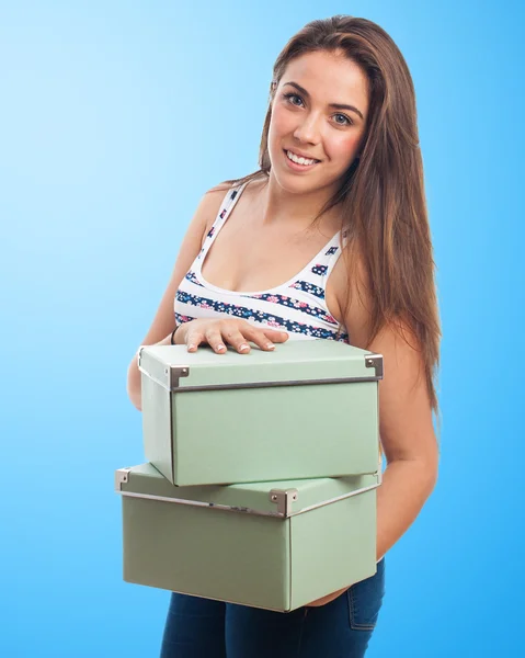 Woman holding  vintage boxes