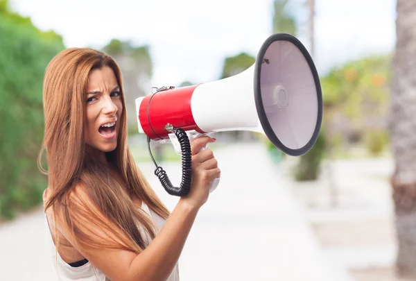 Woman shouting with a megaphone