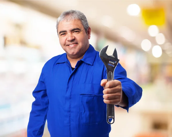 Mechanic holding monkey wrench