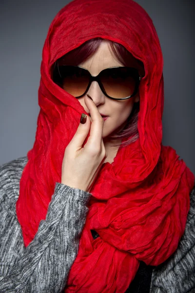 Woman with fashion red head scarf