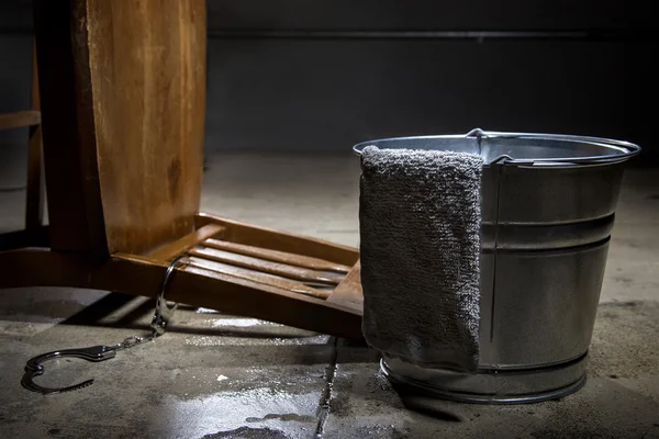 Torture chamber with a water bucket