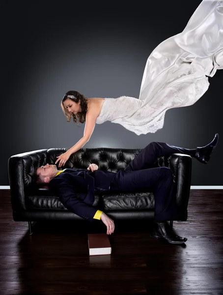 Man dreaming on a couch of a woman